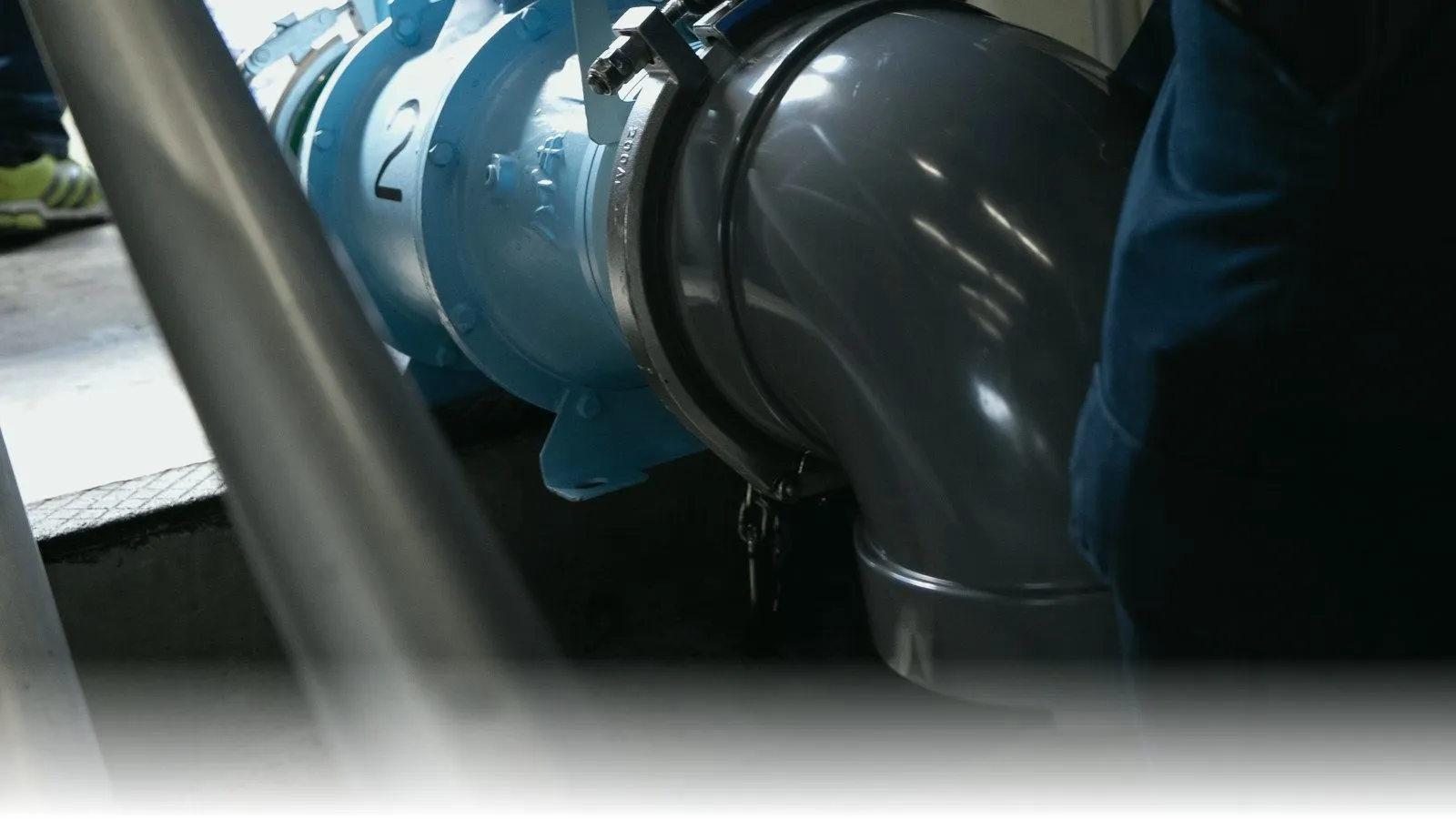 Kubota Handy Mobile Pump Unit (mini) brochure cover showing the pump head, control panel, and complete deployment configuration with discharge hose